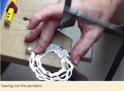 Sawing out the pendant.